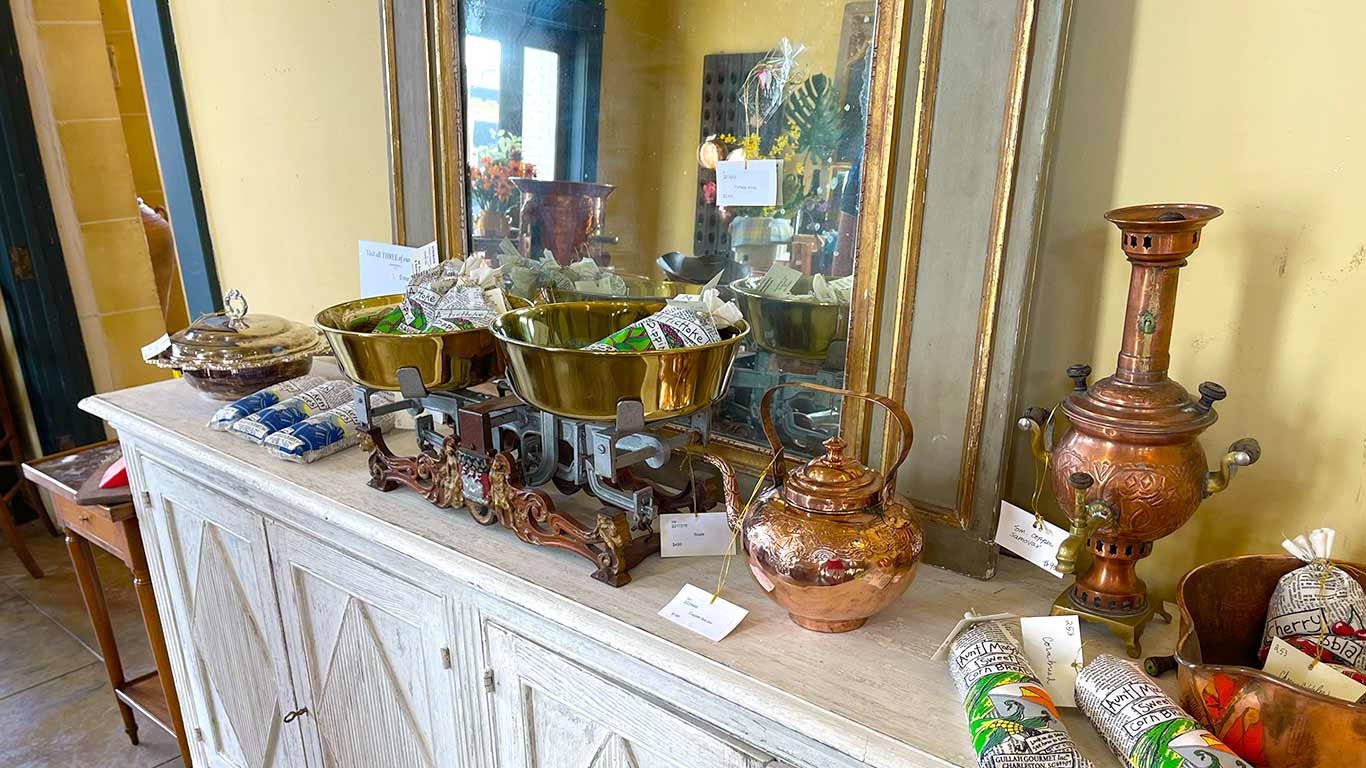antique bleached console with antique mirror and culinary accessories