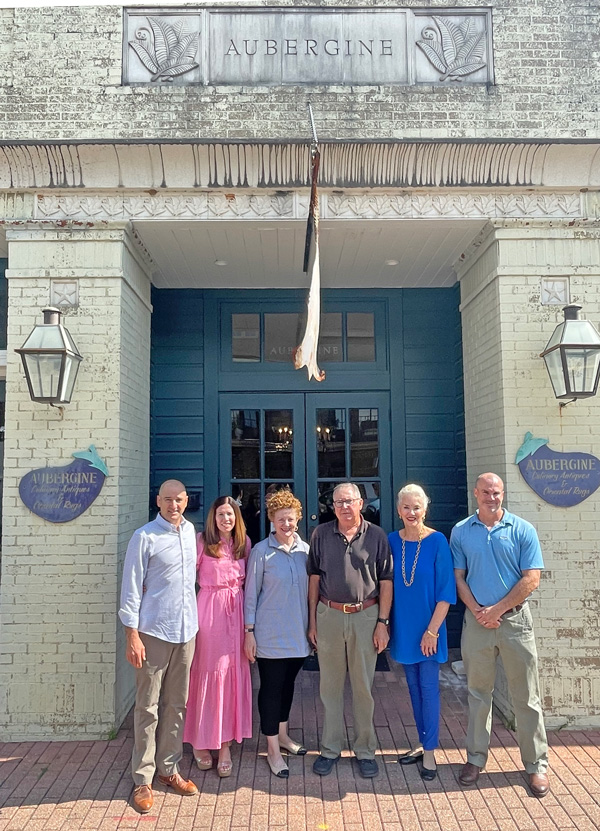 fargason family standing in front of Aubergine Antiques building