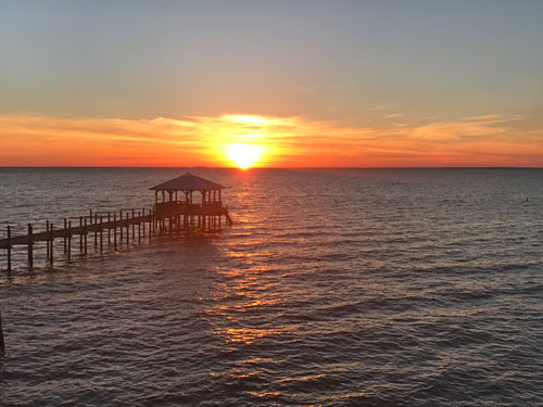 sunset over mobile bay from bluffs in fairhope alabama
